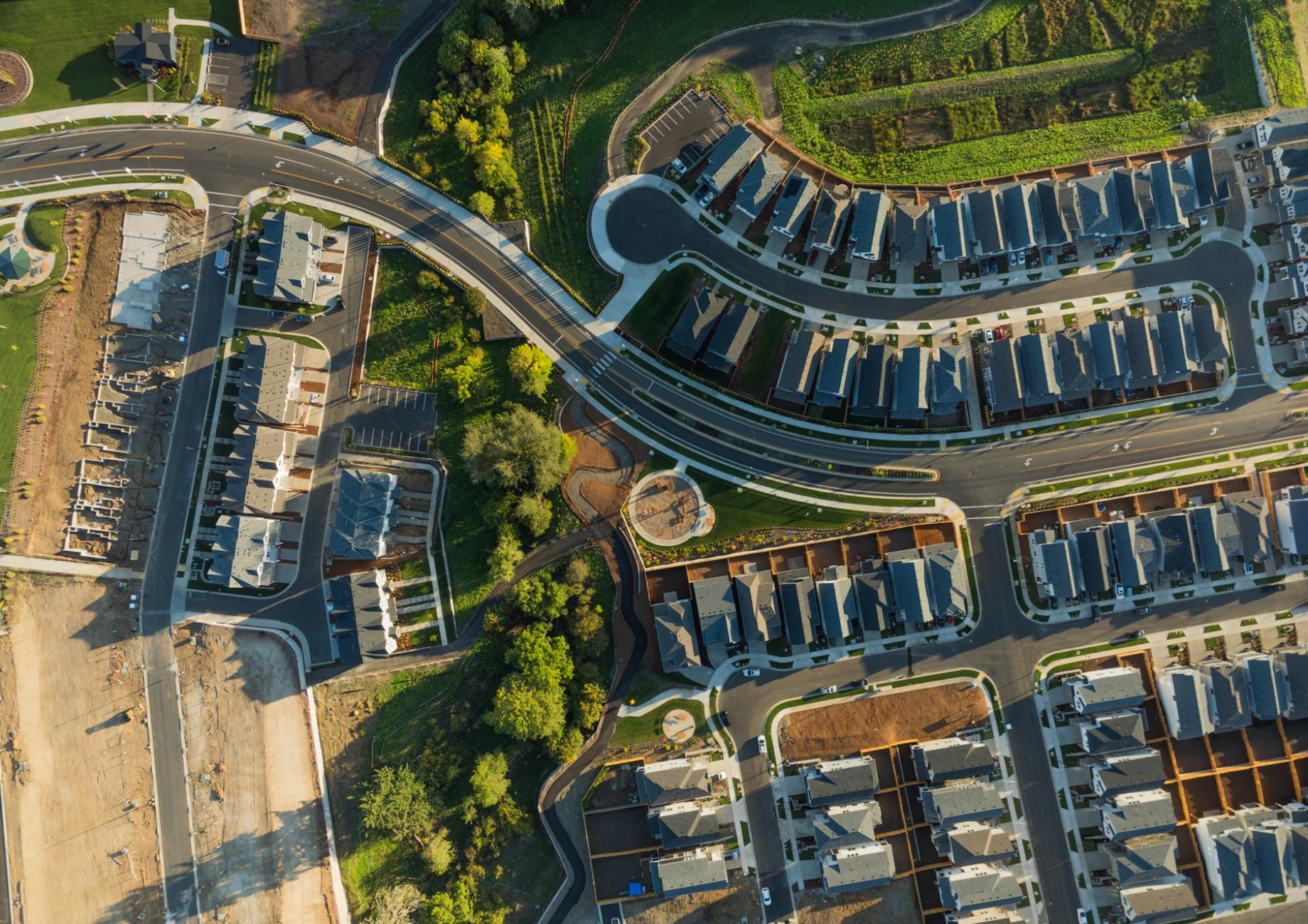 An aerial view of a new UK housing development with some units still under construction