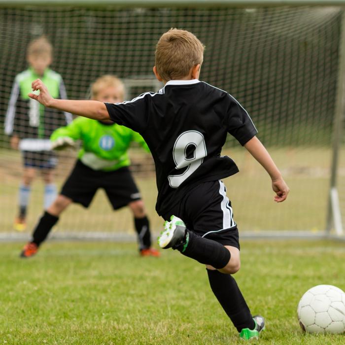 Kids playing football