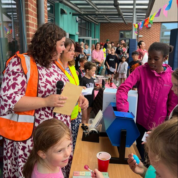 Residents of a housing development in the UK attending a community event