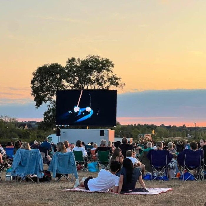 Residents getting together for an outdoor movie night